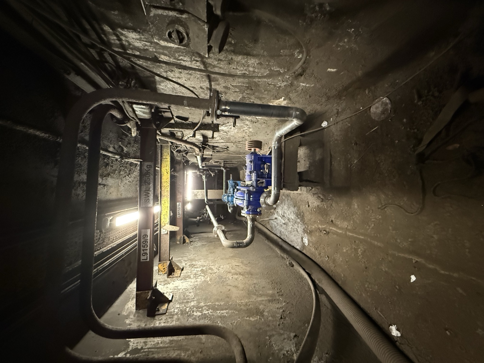 Underground service duct running toward the refitted pump and valve station