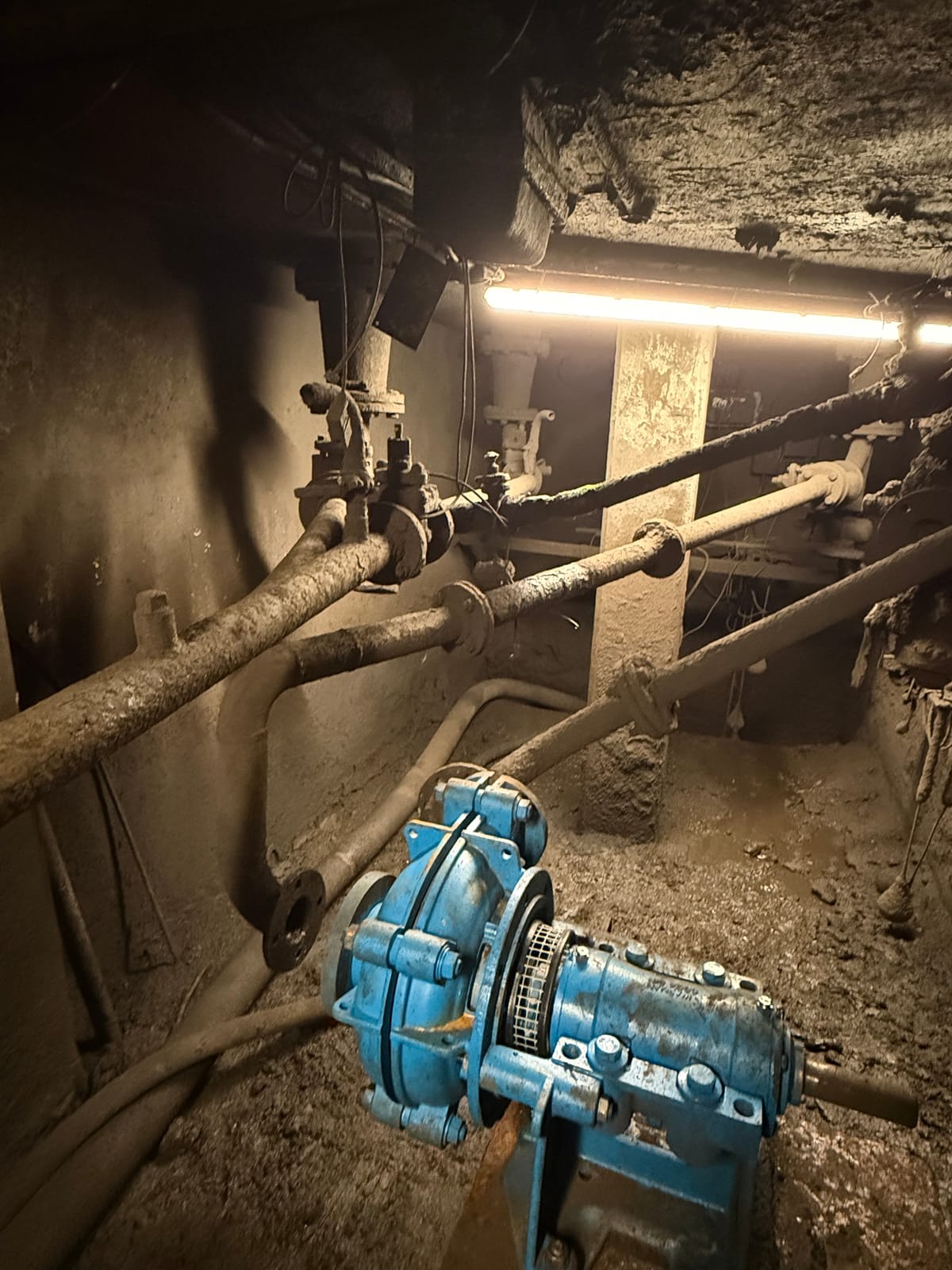 The old encrusted pipework runs feeding the clarifier pump