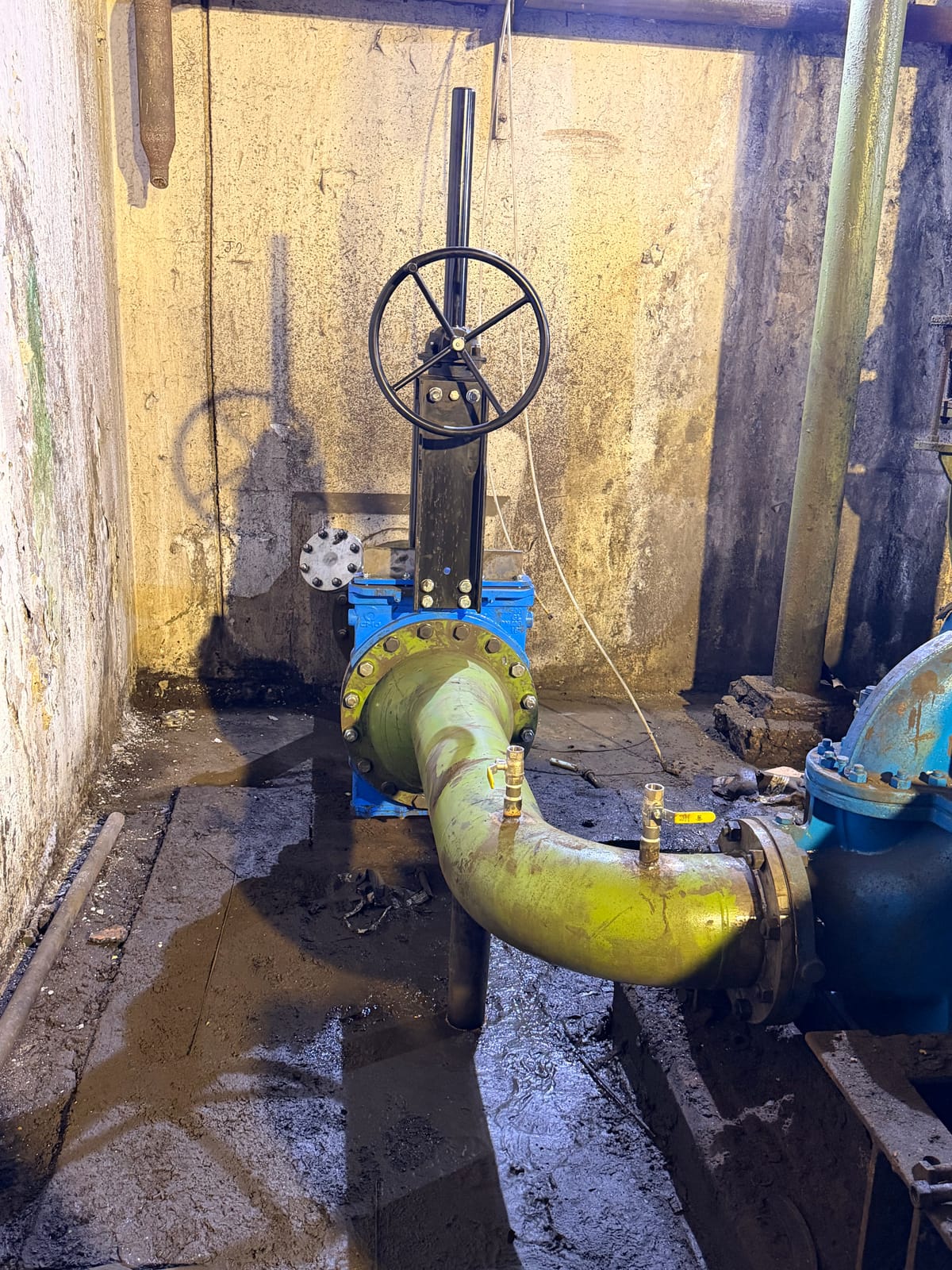 Knife gate valve and the new pipework bend tying it back into the existing line