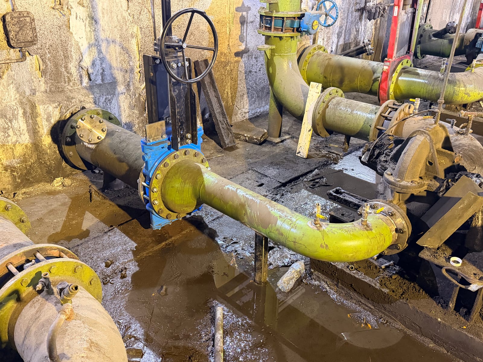 The valve and the new pipework run seen along the chamber
