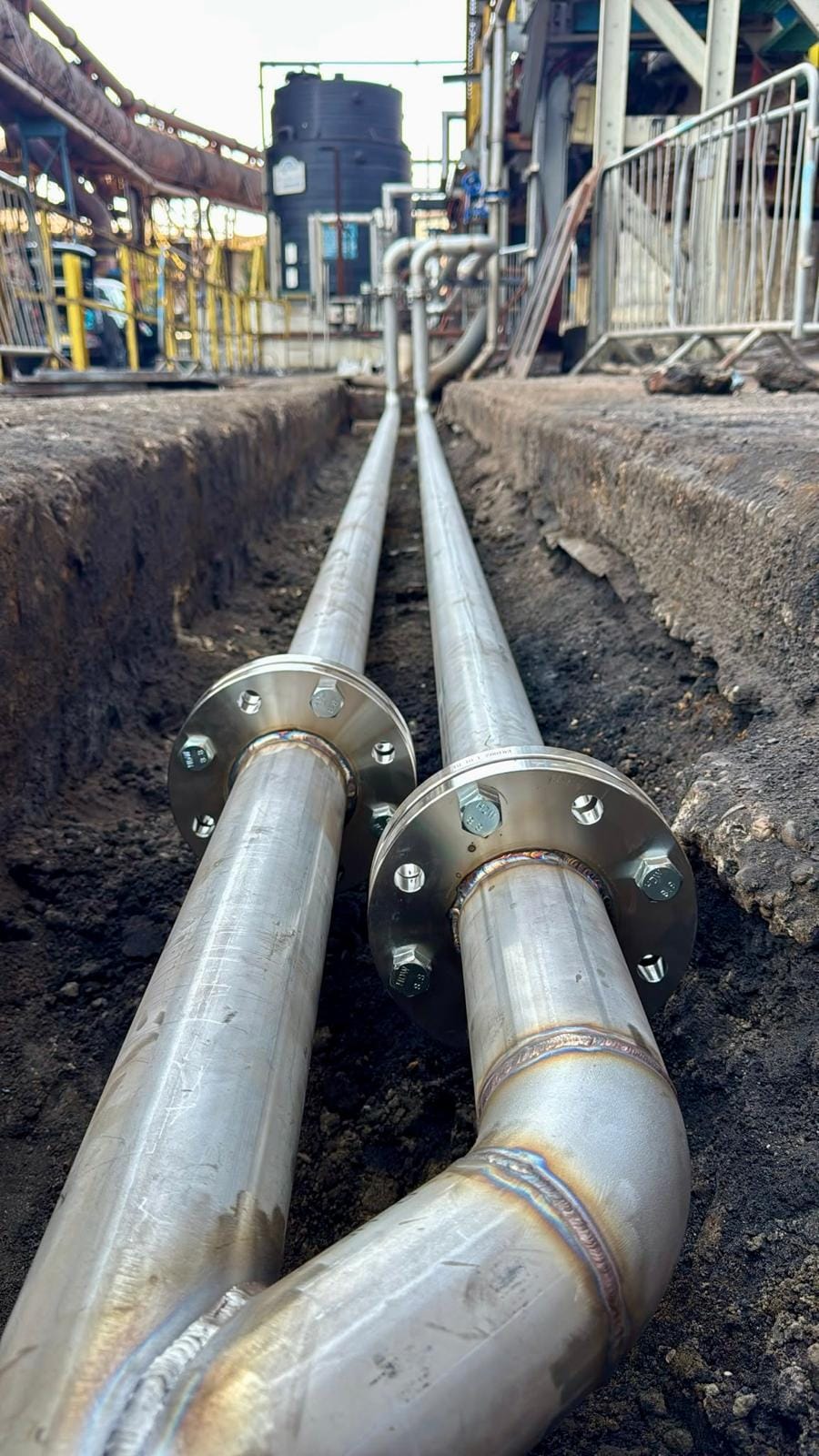 Bolted flange joints on the new pipework where it runs through the pit